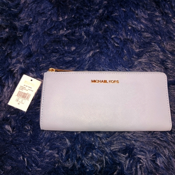 Michael Kors Handbags - Nwt michael kors powder blue jet set travel lg 3 qtr zip saffiano leather wallet